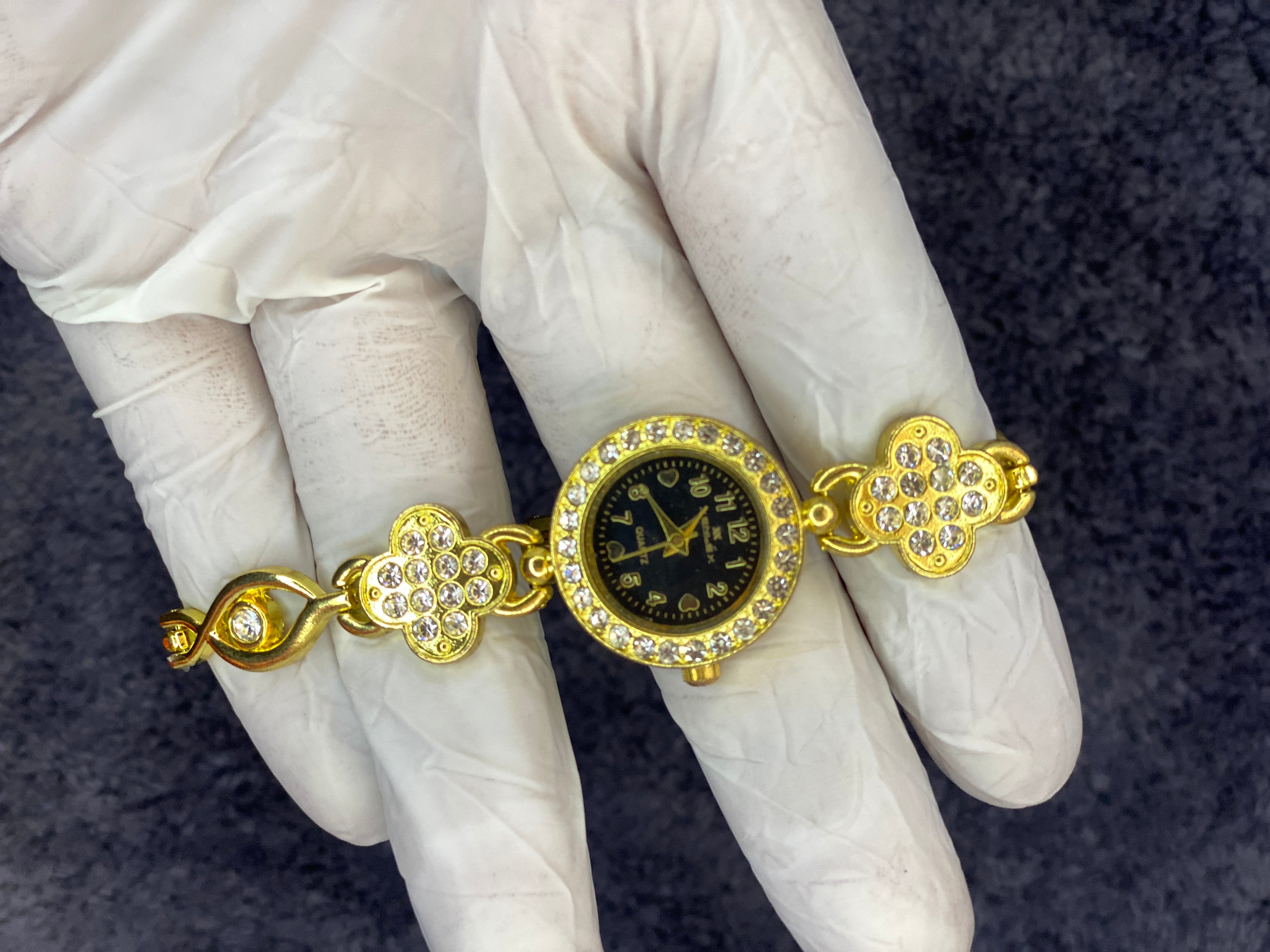 Woman, golden diamond luxury watch ￼