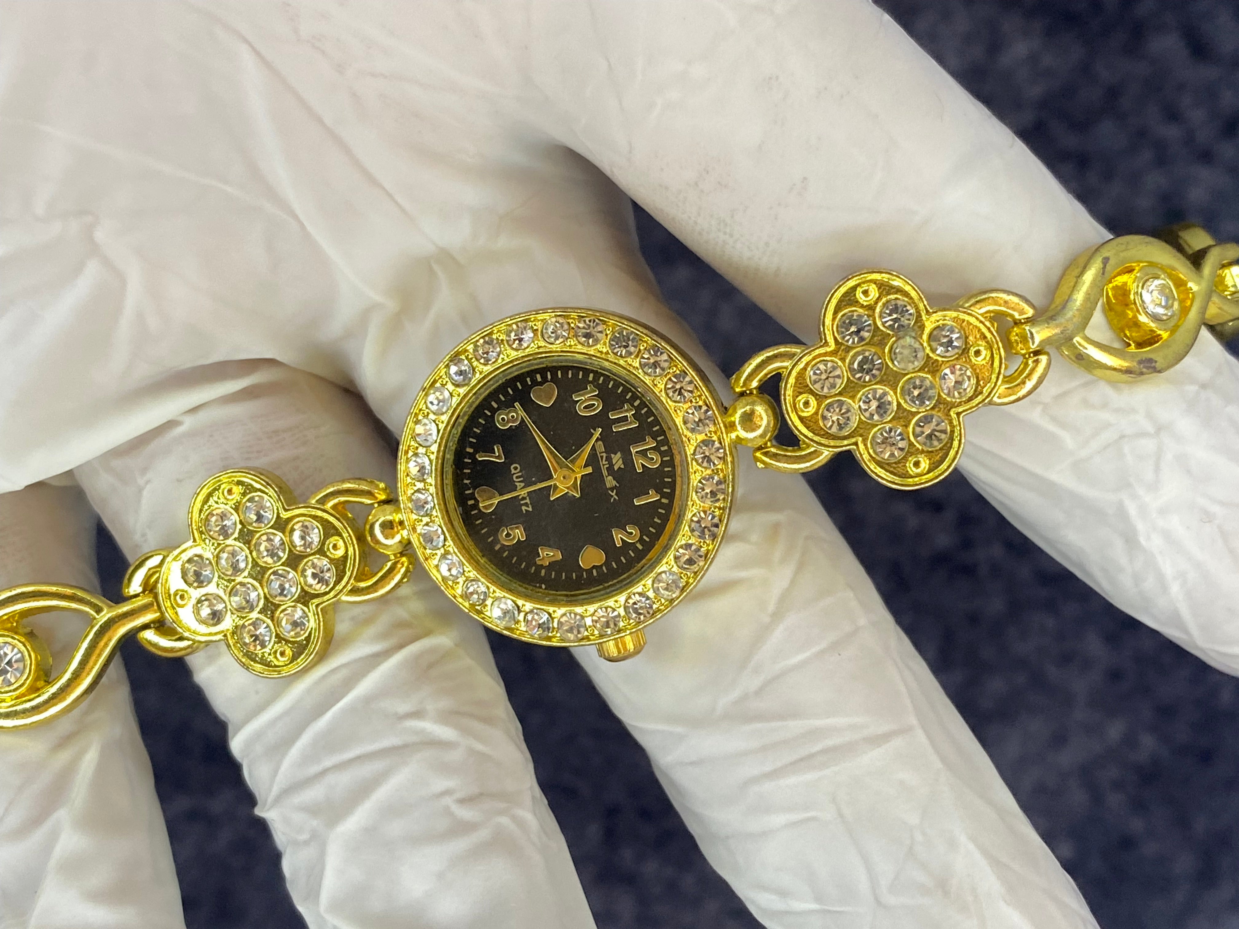 Woman, golden diamond luxury watch ￼